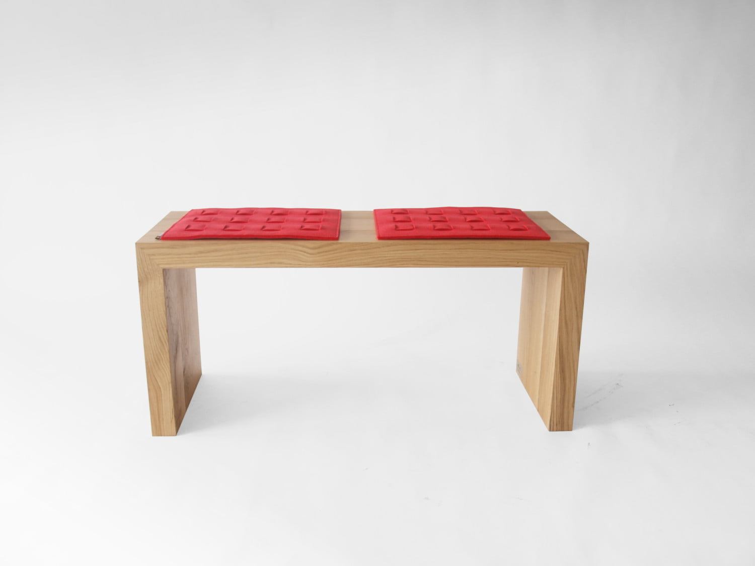 oak wooden simple minimalist bench with red felt pads