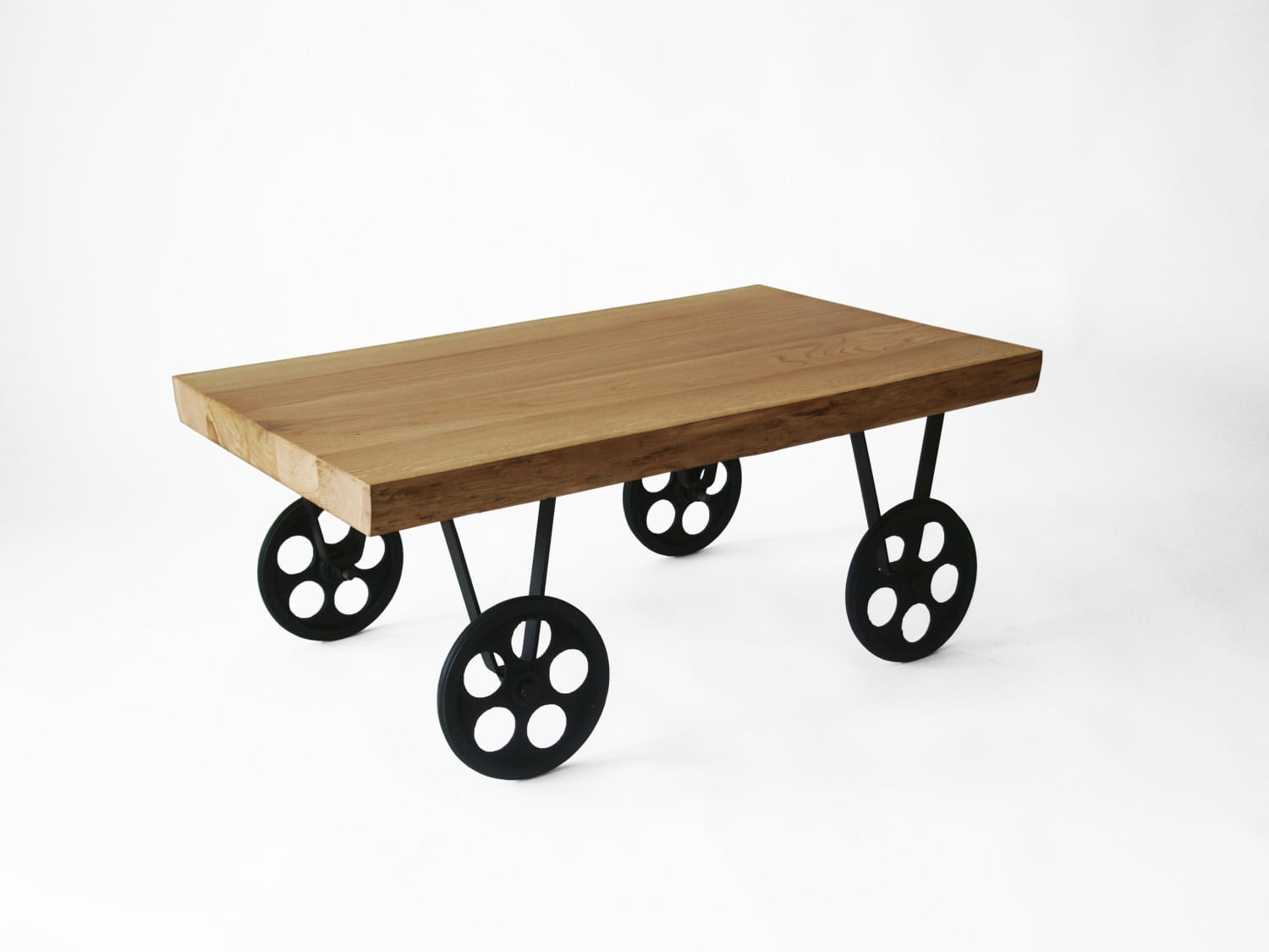 TOLIK 01 oak coffee table on black metal wheels in an industrial style